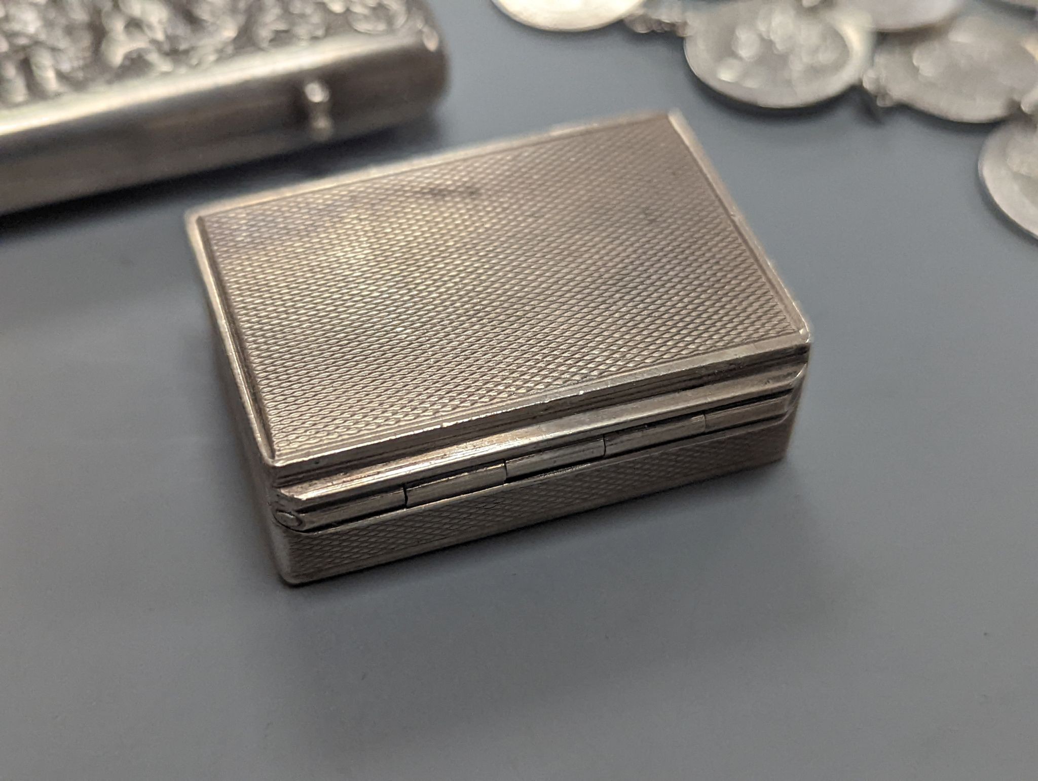 Two Austro Hungarian white metal snuff boxes, a bracelet and coin bracelet.